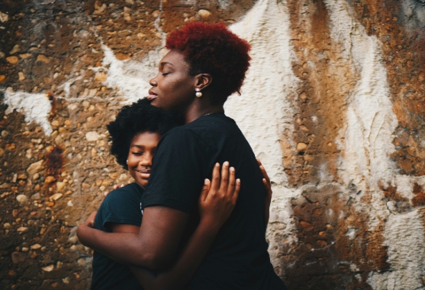 A woman hugging her child